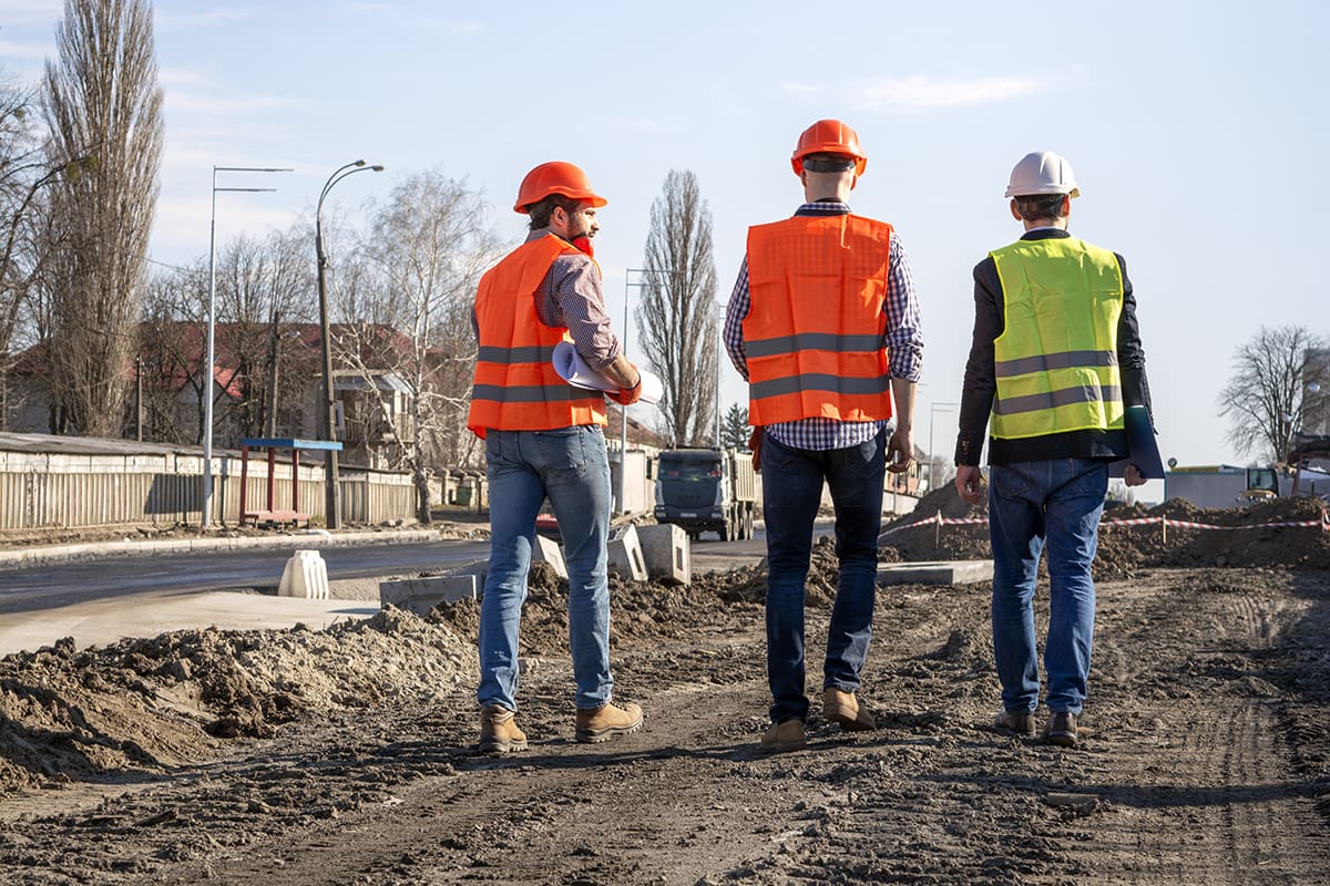 Men on jobsite discussing closeout items